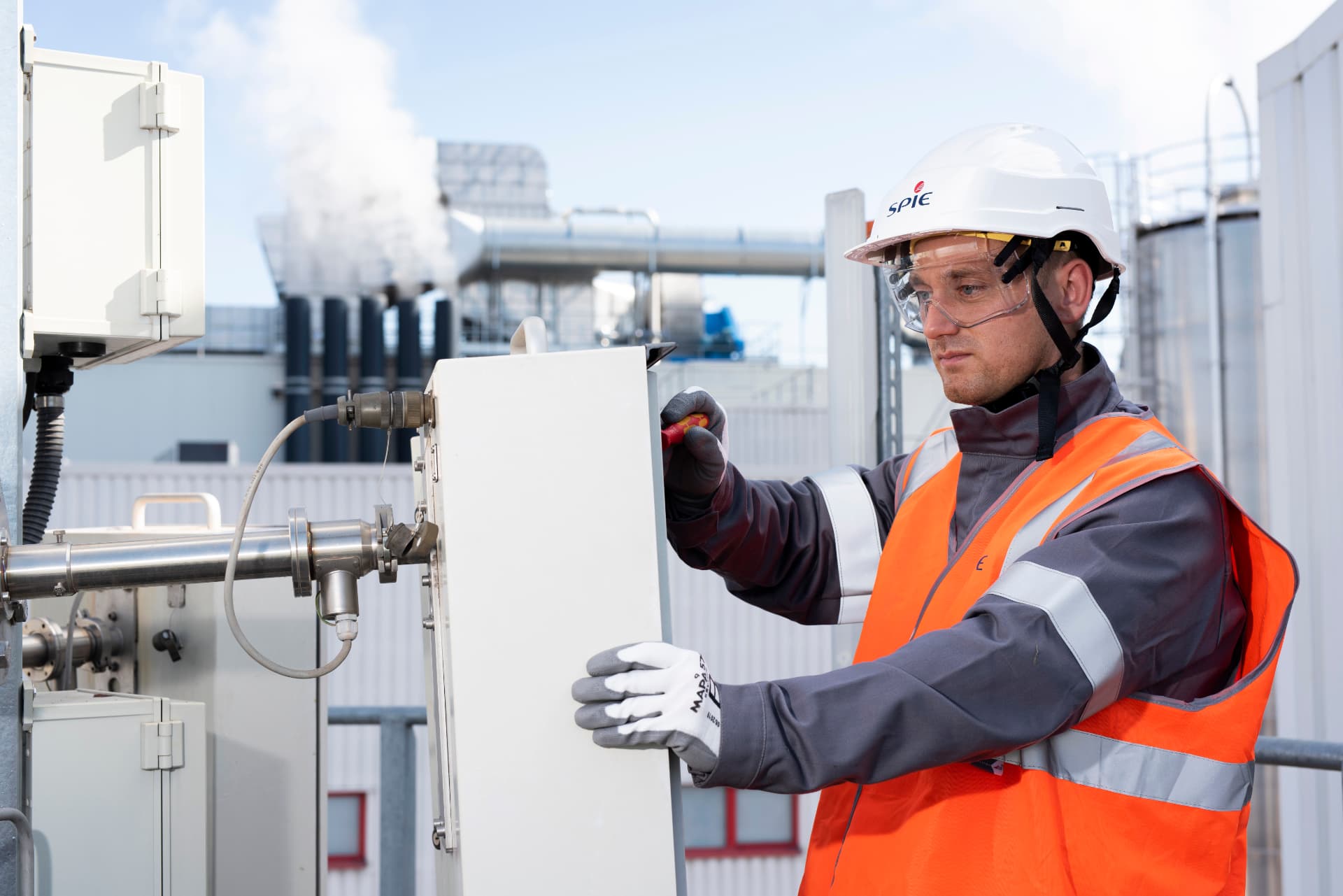 SPIE technician servicing an instrumentation cabinet on site