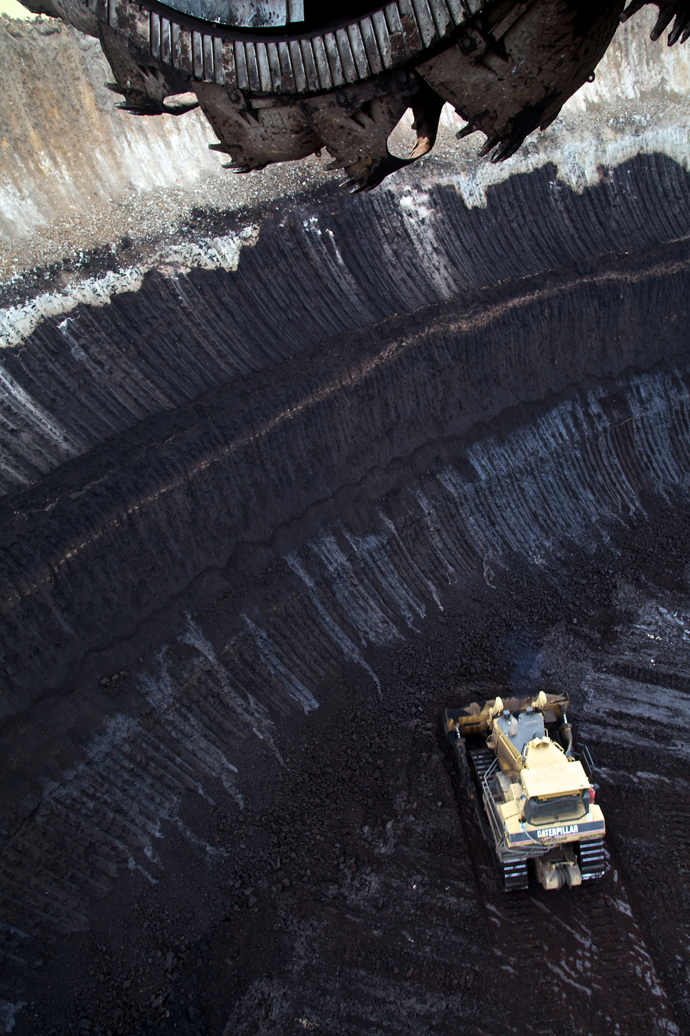 Aerial view of the coal face and a dozer working below the dredger